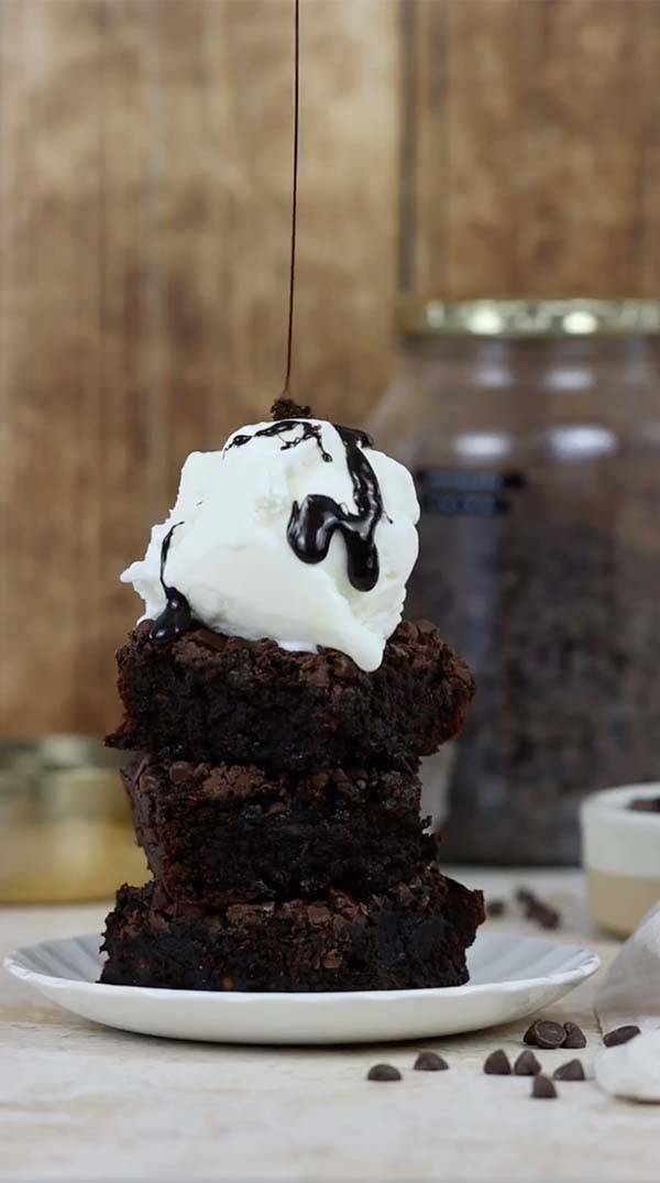 Demo video showing fudgy brownies being made and served with vanilla ice cream.