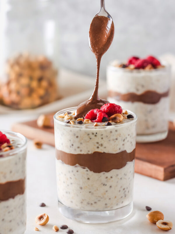 Chia seed pudding with berries and chocolate peanut butter sauce.
