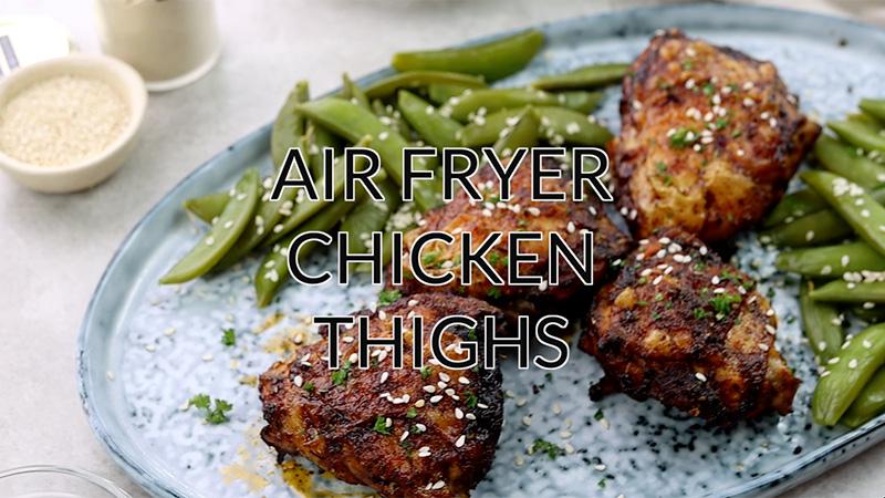 Air fryer chicken thighs with snap peas.